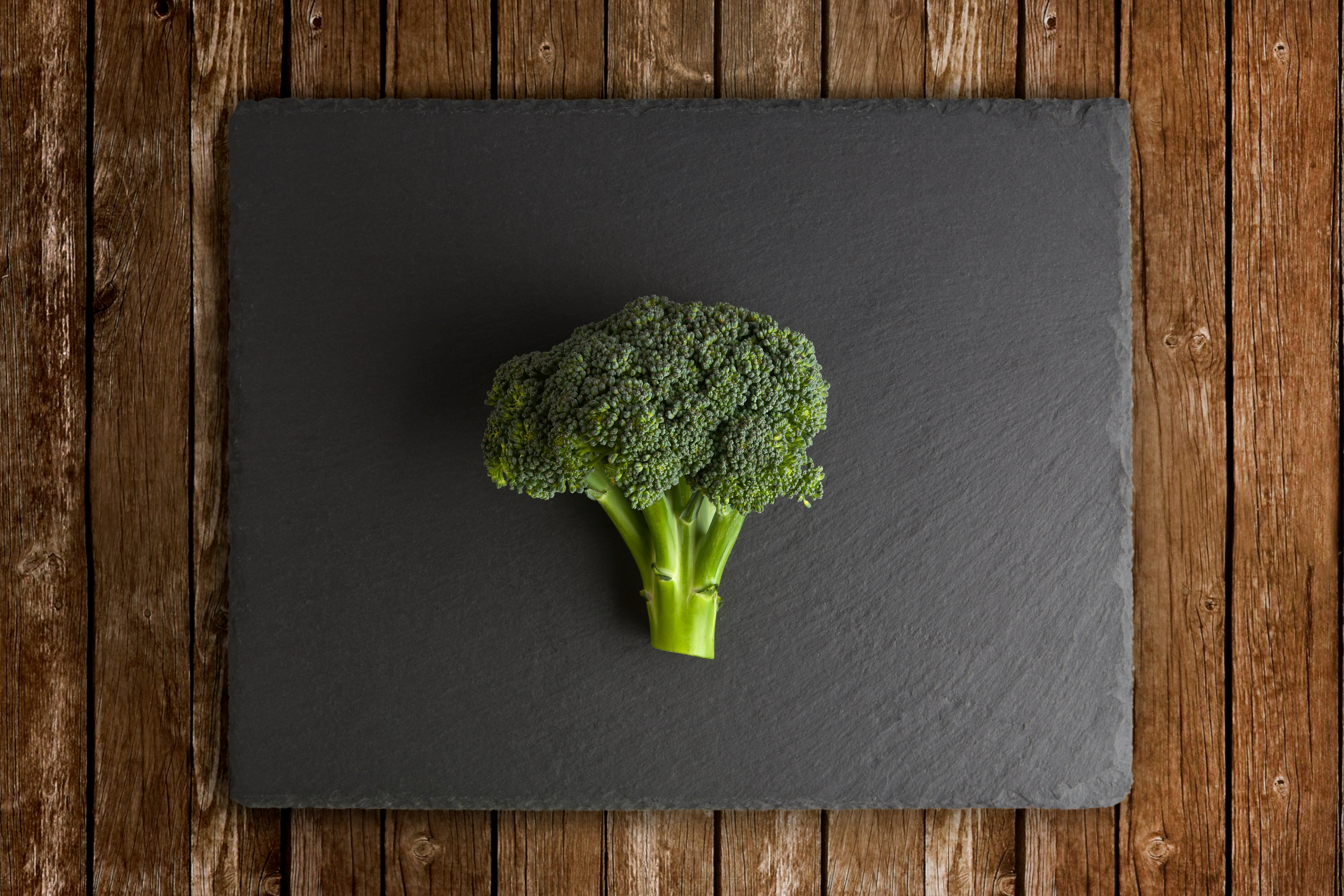 green broccoli on black surface